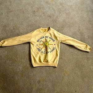 a yellow crewneck